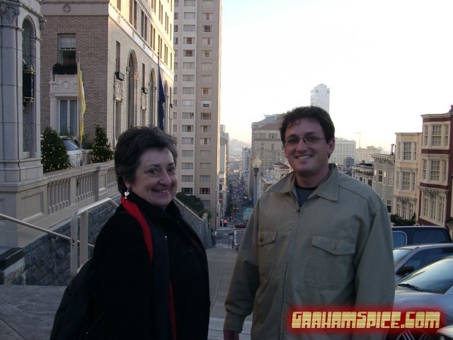 Mom and Reid in front of a very steep hill, possibly even russian.
