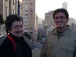 Mom and Reid in front of a very steep hill, possibly even russian.