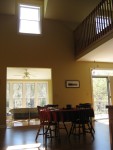 Taken from Kitchen showing dining area, sun room and upstairs loft area